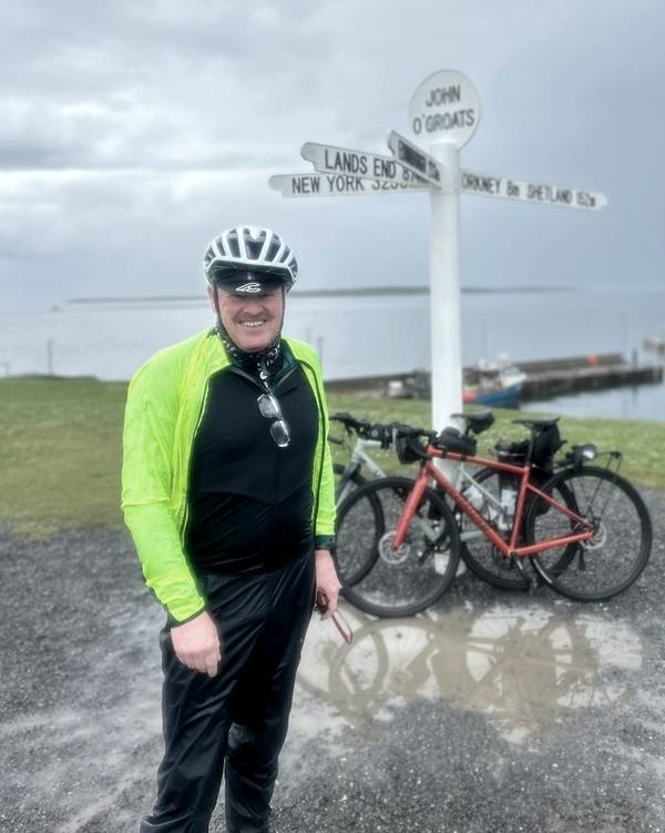 Neil Innes cycling on his 1,600km Land's End to John O'Groats challenge